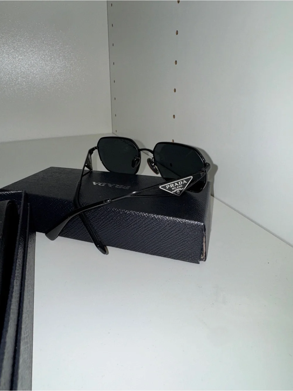 Prada Women’s Black Metal Frame Sunglasses with Dark Lenses